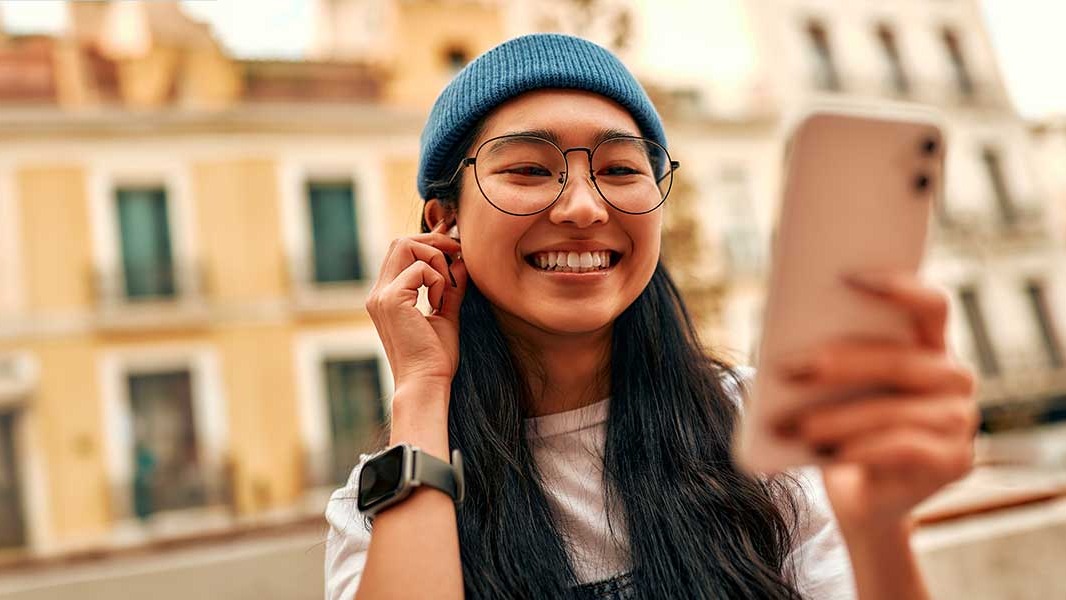 girl looking at phone in street 1